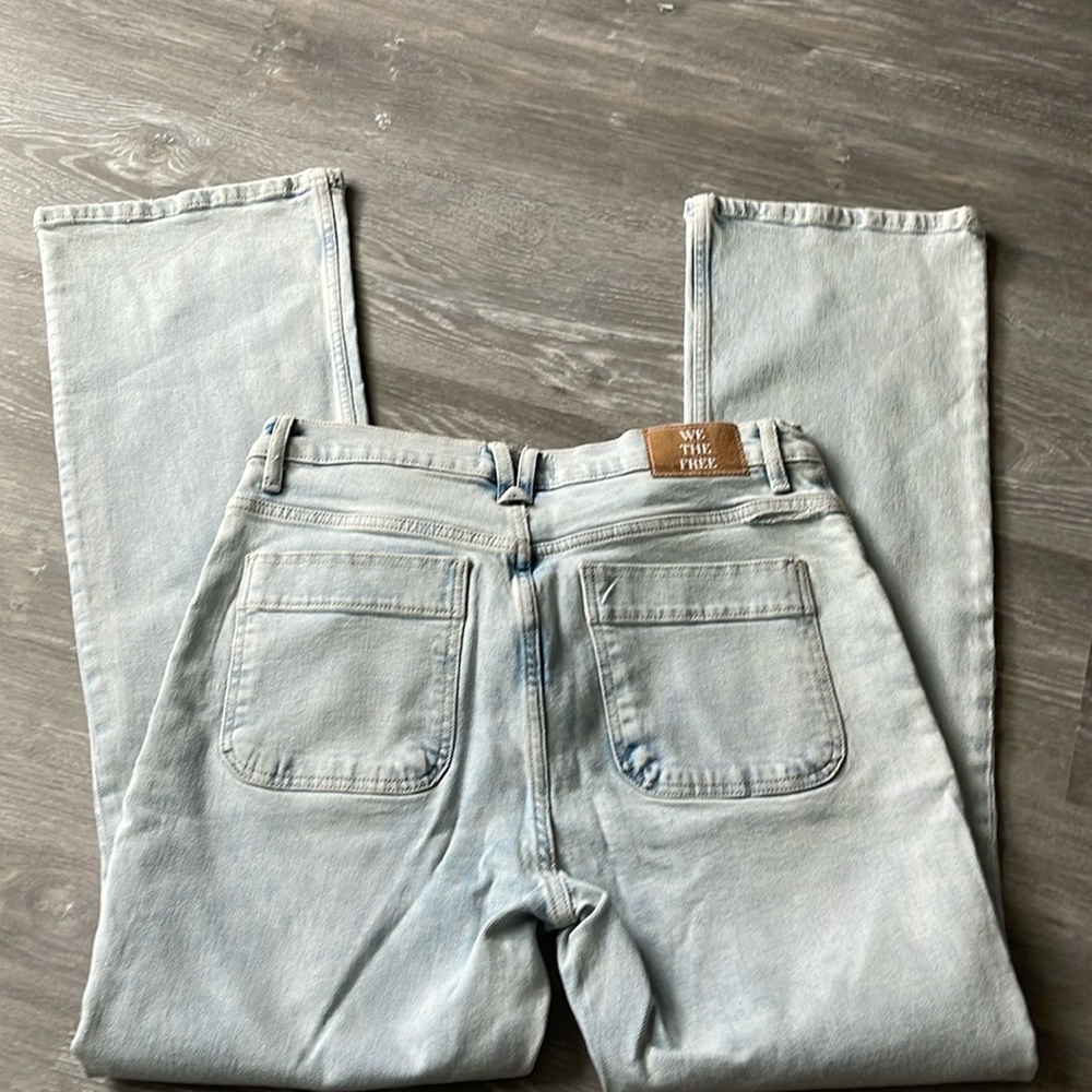 We the free light wash bootcut jeans.